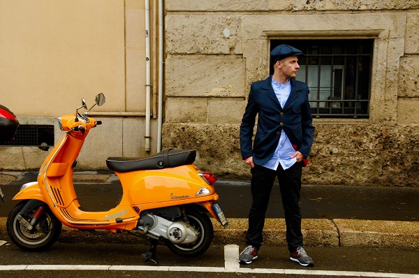 boy and a yellow vespa